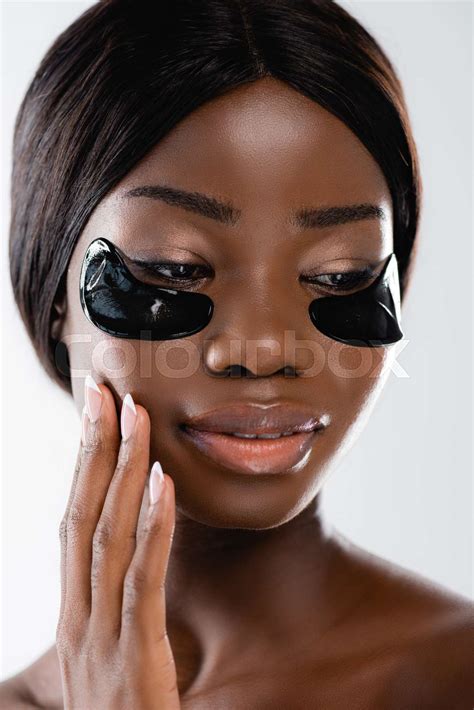 Portrait Of African American Naked Woman With Hydrogel Eye Patches On