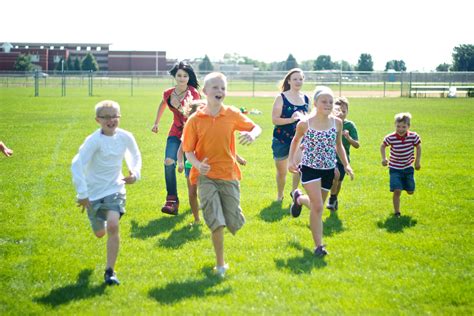 kids running on school field - Health Powered Kids