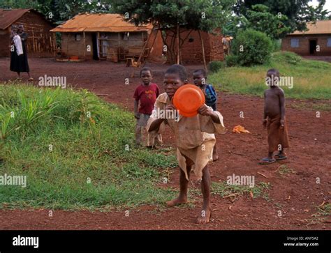 Group Of Children Boy Girl Mother Shack Village Play Outdoor Look Game