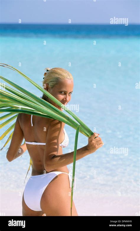 Woman on tropical beach. Maldives Islands Stock Photo - Alamy