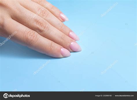 Women S Hands With Perfect Nude Manicure Nail Polish Is A Natural Pale Pink Shade Blue
