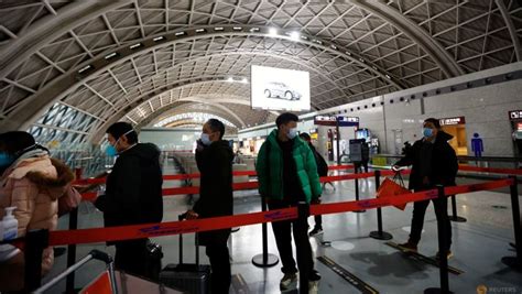 Travel curbs rack up as COVID-hit China readies reopening - CNA