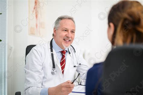 Doctor talking to a patient - stock photo 1988182 | Crushpixel