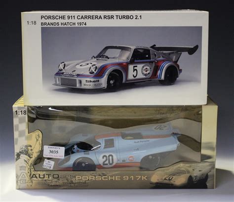 Four Autoart 1:18th scale Porsche sports cars, comprising a Steve ...