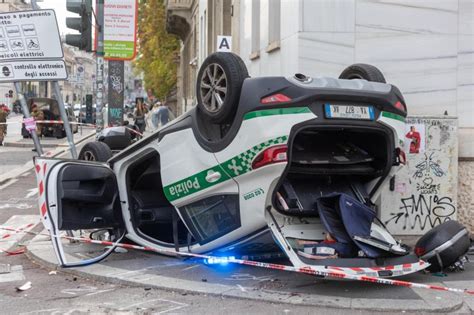 Milan police car overturns after spectacular crash with Ferrari