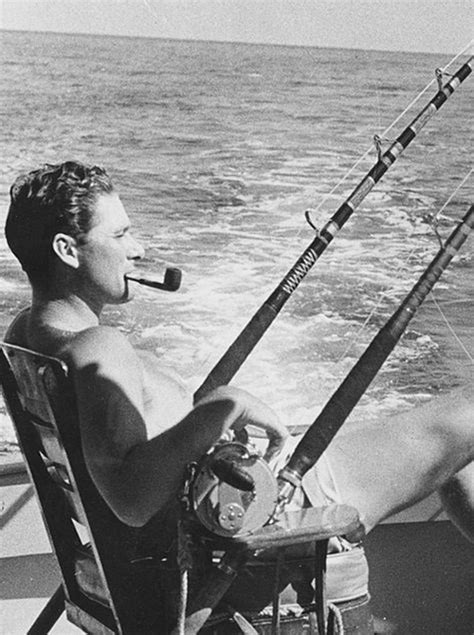 Download Errol Flynn Smoking Pipe By Water Wallpaper