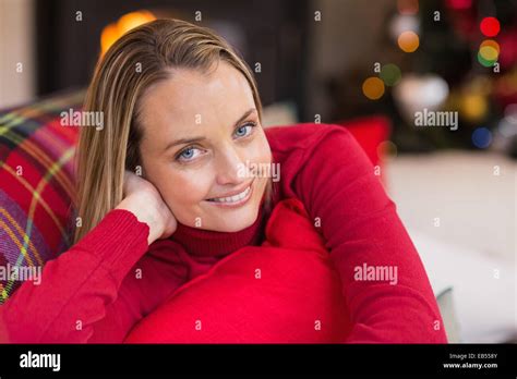 Blonde Woman Lying On The Couch While Smiling At Camera Stock Photo Alamy