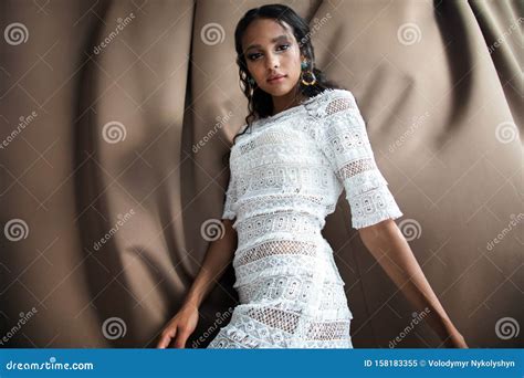 Cute African Girl In White Lacy Dress Posing Fotografering För