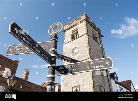 St Albans clock tower and tourist signpost, St Albans, Hertfordshire ...