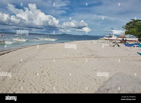 An Idyllic White Sand Beach Of Pamilacan Island In The Philippines With