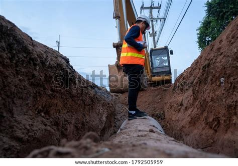 Engineer Wear Safety Uniform Examining Excavation Stock Photo