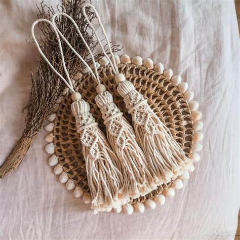 Three Tassels Are Laying On Top Of A Bed