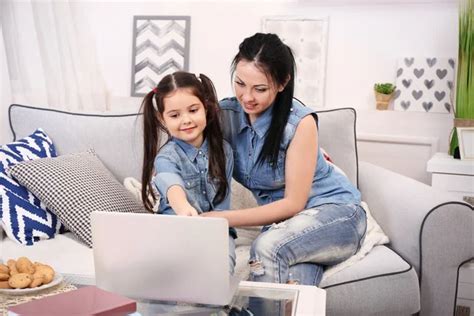 Mother And Daughter Watching Cartoons Stock Image Everypixel