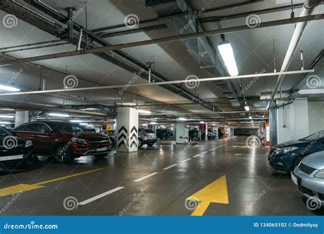 Illuminated Underground Car Parking Interior Under Modern Mall With