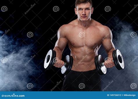 Muscular Fitness Sports Man Atlete With Dumbbell In Fitness Gym