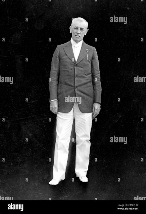 President Woodrow Wilson (full length, black background) ca. 1910s Stock Photo - Alamy