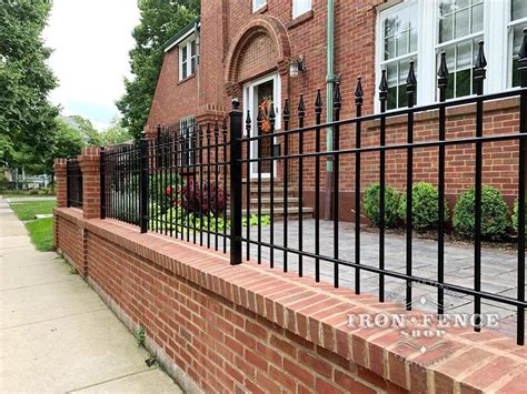 A Beautiful Combination Iron Fence With Brick Walls And Brick Columns