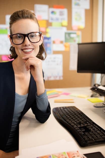 Premium Photo Portrait Of Smiling Businesswoman Wearing Eyeglasses