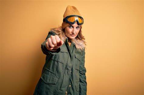 Premium Photo Middle Age Beautiful Blonde Skier Woman Wearing Snow Sportwear And Ski Goggles