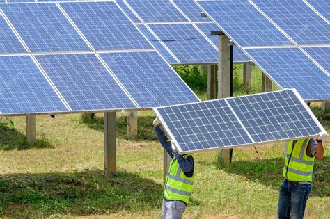 Premium Photo A Team Of Two Men Install Solar Panels Work On Installing Solar Panels At A