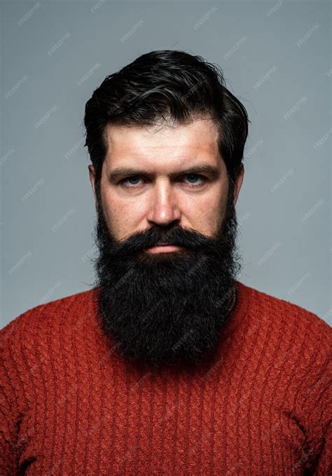 Premium Photo Portrait Of Confident Serious Man Has Beard And Mustache Looks Seriously