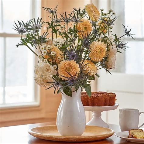 The Blue Star Shaped Blossoms Of Sea Holly Add Intriguing Form And Color To This Artful Bouquet