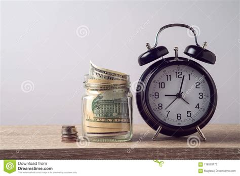 finance concept  alarm clock  money stock image image