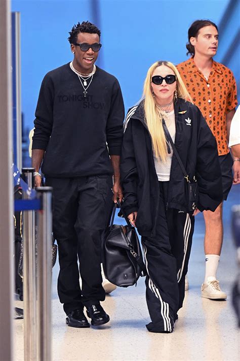 Madonna Wears Sheer Top While Going Through Airport Security With Son Hollywood Life