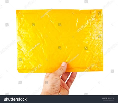 Hand Holding Yellow Mail Package Isolated Stock Photo 126761792