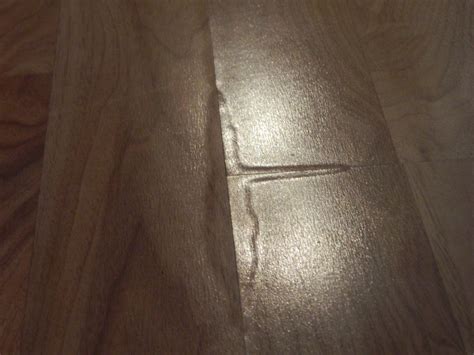 Swelling Bubbling In Laminates And Hardwood Floors Causes Solutions