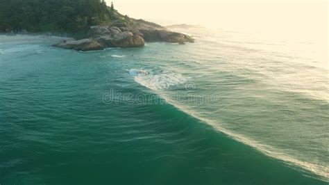 Aerial View Of Joaquina Beach At Sunrise And Mountains Rocks And