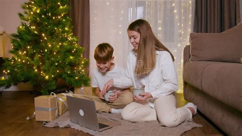 Brother And Sister Call Relatives Via Video Link From Laptop To Wish