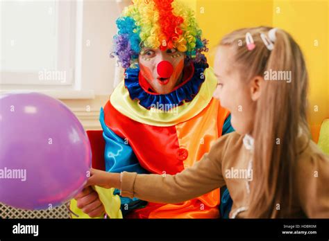 Amusing Clown Give Air Balloon To The Little Girl Stock Photo Alamy