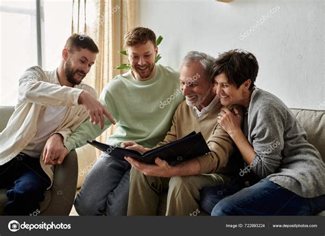 Gay Couple Sits Parents Looking Photo Album Together Stock Photo HayDmitriy