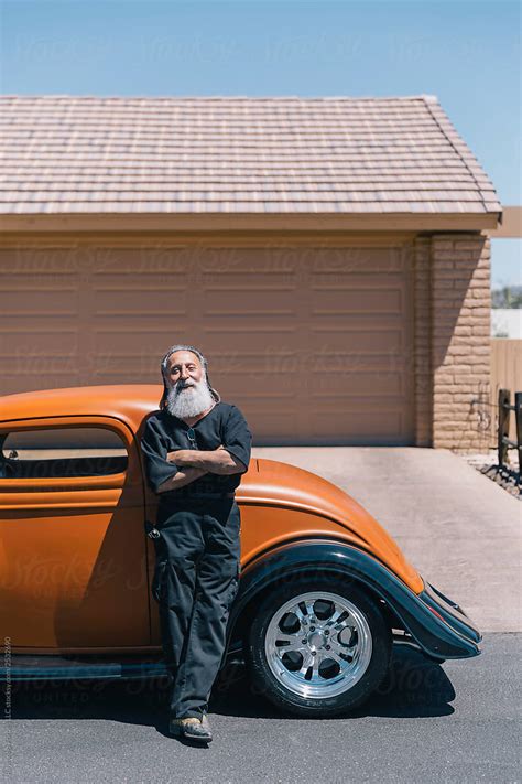 Retired Senior Man With His Antique Hot Rod Car By Stocksy Contributor Raymond Forbes LLC