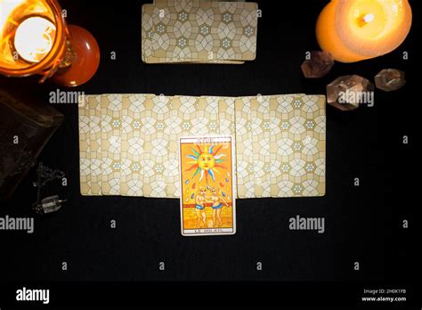 Tarot sun card on a group of cards face down. Concept of a divination ...