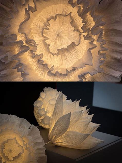 Two Different Views Of The Same Light Fixture One With White Flowers