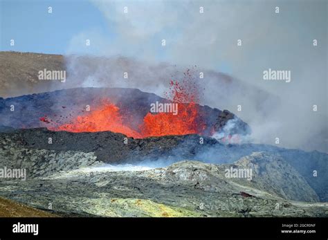 Sulphur Fields In Front Of Volcanic Craters Glowing Lava Fountains