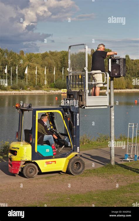 Man Standing On Forklift Dismounting Loudspeakers Stock Photo Alamy