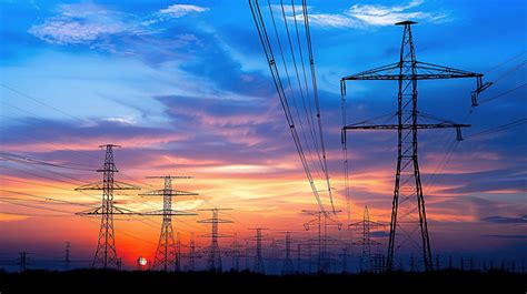 High Voltage Power Line Supports At Sunset Background Support Energy