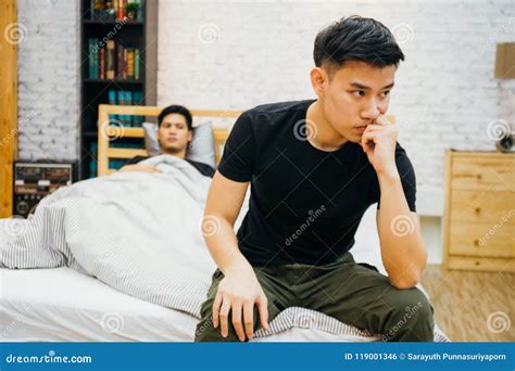 Asian Gay Couple Having Argument With Each Other In Bedroom Thoughtful Gay Man Having Stress