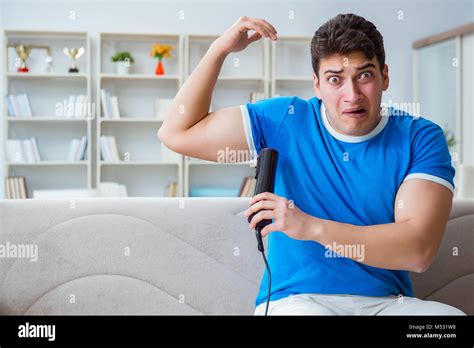 Man Sweating Excessively Smelling Bad At Home Stock Photo Alamy