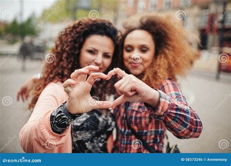 Friends Making Heart Shape With Fingers Stock Photo Image Of Love