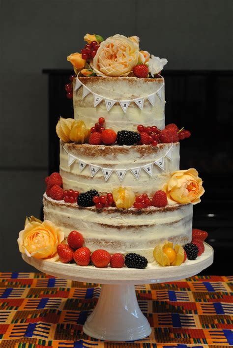 Semi Naked Wedding Cake With Garden Roses And Berries