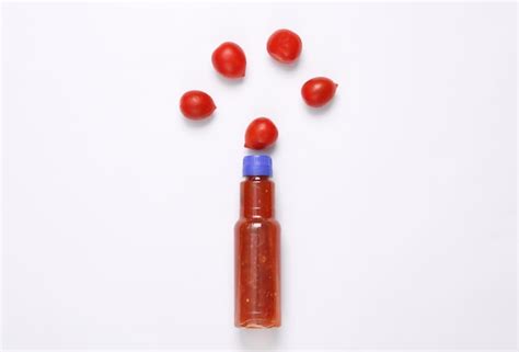 Premium Photo Bottle Of Tomato Spice Sauce Ketchup With With Cherry Tomatoes On White Background