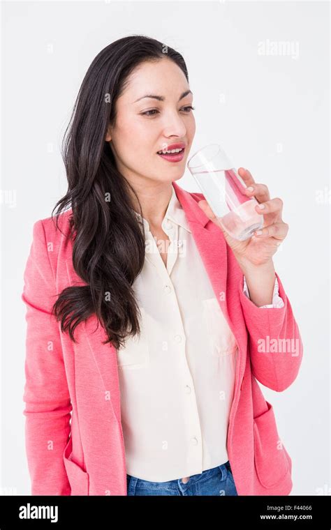 Pretty Brunette Drinking Water Stock Photo Alamy