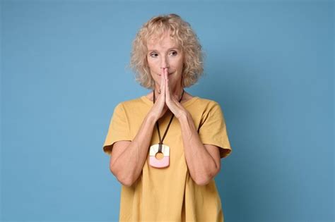 Premium Photo Senior Woman Stands In Meditative Pose Enjoys Peaceful