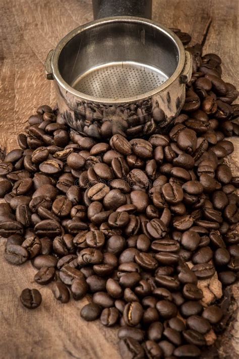 Roasted Columbian Coffee Beans Placed On A Wooden Table Stock Photo