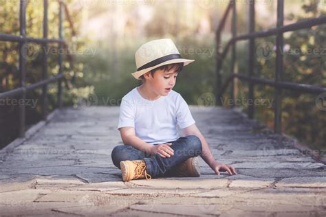 happy child sitting on the floor 6084906 Stock Photo at Vecteezy