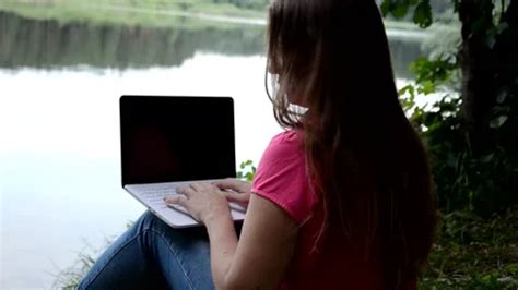 Cute Blonde Girl Sitting On The Lake And Stock Video Pond5